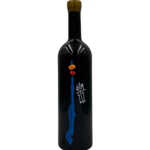 Bottiglia di vino nero Giorgio Mercandelli Archetijs Zianco 2019 con un'etichetta artistica che presenta una pennellata blu verticale con elementi arancioni e bianchi nella parte superiore, e la scritta stilizzata bianca "G/M" sopra "1/2" a destra.