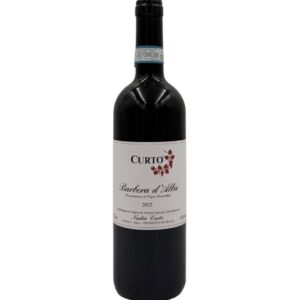 Bottiglia di Nadia Curto Barbera d'Alba Curto 2022 con etichetta chiara che evidenzia il nome del produttore "CURTO" in grande, seguito dalla denominazione "Barbera d'Alba Denominazione di Origine Controllata", l'annata "2022" e il nome "Nadia Curto" in basso. Un piccolo disegno stilizzato di foglie rosse è presente sopra la scritta "Barbera d'Alba".