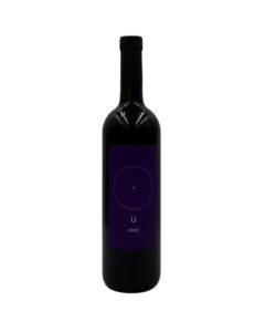 Bottiglia di Giorgio Mercadelli U Rosso Vino Rosso 2007 con un'etichetta viola scura minimalista che presenta un cerchio con un punto al centro, la lettera "U" e l'annata "2007".