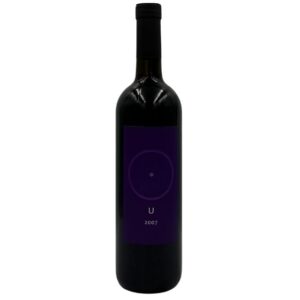 Bottiglia di Giorgio Mercadelli U Rosso Vino Rosso 2007 con un'etichetta viola scura minimalista che presenta un cerchio con un punto al centro, la lettera "U" e l'annata "2007".